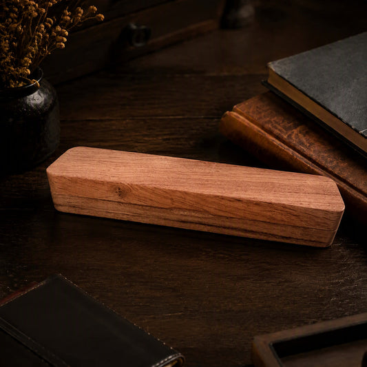 Luxury wooden pen gift box closed, natural wood grain on dark desk